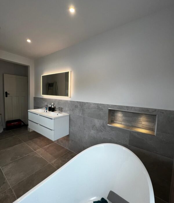 Bathroom Renovation 1 wide image of mirror and build in shelf.
